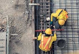 workmen pouring concrete