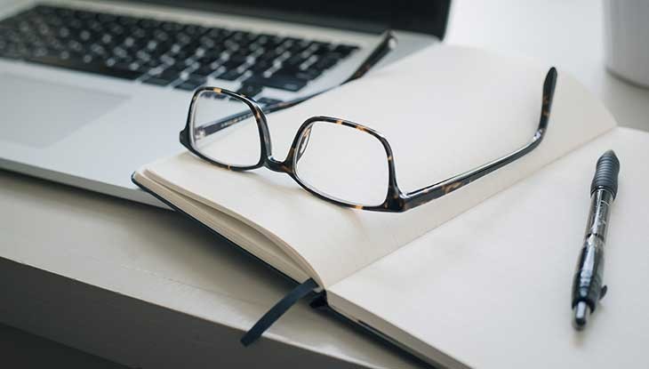 glasses on a notebook